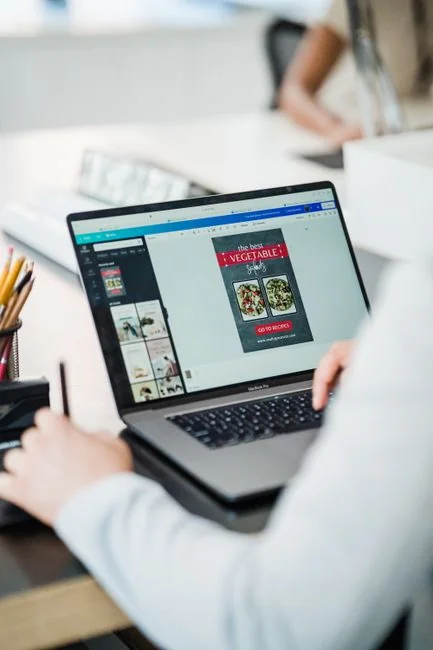 Laptop screen showing Pexels website, ideal for stock photo needs.